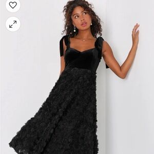 velvet top with adjustable straps to tie in a bow. Bottom roses made of tulle